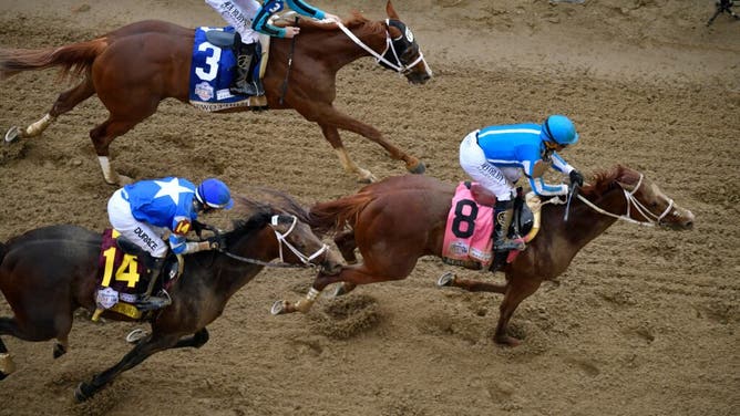 Mage, with jockey Javier Castellano leads Two Phil's with Jareth Loveberry and Angel of Empire with Flavien Prat across the finish line to win the 147th running of The Kentucky Derby in Louisville.