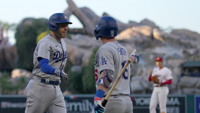 Dodgers 1B Freddie Freeman is congratulated by C Will Smith after hitting a solo HR vs. the Los Angeles Angels at Angel Stadium in Anaheim.