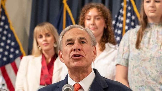 Abbott at a bill signing