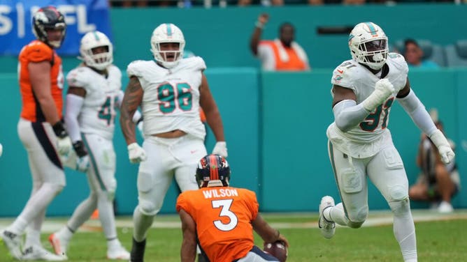 Dolphins DE Emmanuel Ogbah celebrates a sack on Denver Broncos QB Russell Wilson at Hard Rock Stadium in Miami.