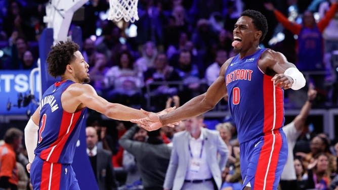 Pistons C Jalen Duren daps up PG Cade Cunningham after scoring vs. the Chicago Bulls at Little Caesars Arena in Detroit.