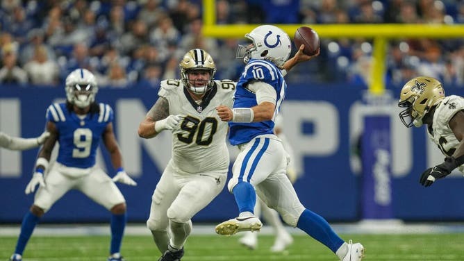 Indianapolis Colts QB Gardner Minshew II gets rid of the ball under pressure by the New Orleans Saints at Lucas Oil Stadium in Indiana.