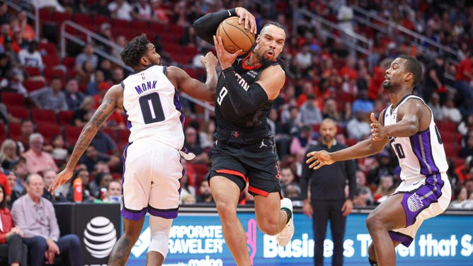 Rockets wing Dillon Brooks drives past Sacramento Kings SG Malik Monk at the Toyota Center in Houston.
