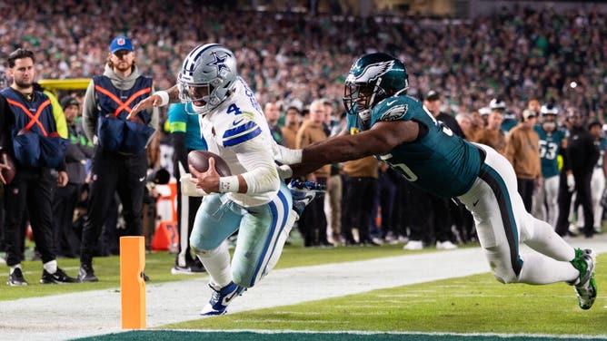 Eagles DE Brandon Graham pushes Dallas Cowboys QB Dak Prescott out of bounds short of a 2-point conversion at Lincoln Financial Field in Philadelphia.