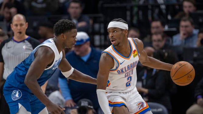 Oklahoma City Thunder All-Star Shai Gilgeous-Alexander backs down Minnesota Timberwolves SG Anthony Edwards at the Target Center in Minneapolis.