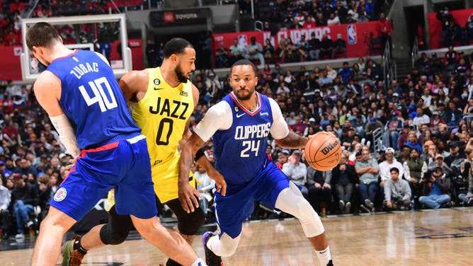 LA Clippers wing Norman Powell dribbles against the Utah Jazz at Crypto.Com Arena in Los Angeles.