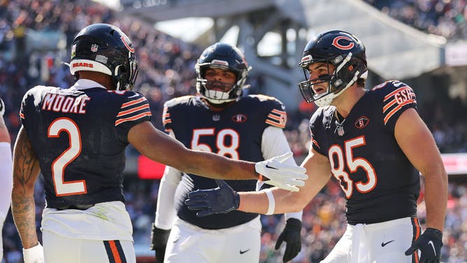 Bears WR DJ Moore high-fives TE Cole Kmet vs. the Las Vegas Raiders at Soldier Field in Chicago.
