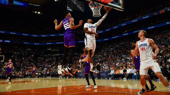 Clippers SF Norman Powell drives to the cup vs. the Suns at Footprint Center in Phoenix.