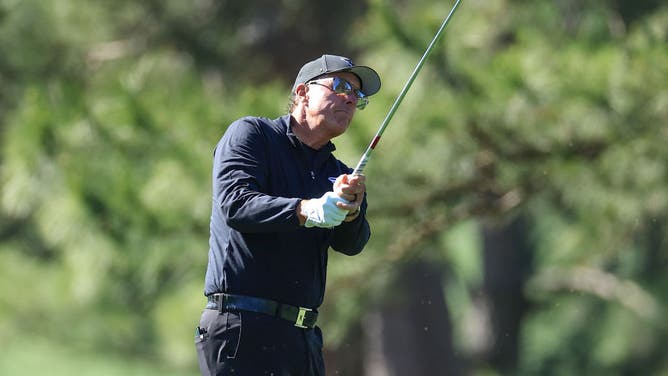 Phil Mickelson of The United States plays his second shot on the 17th hole during the final round of the 2023 Masters Tournament at Augusta National Golf Club.
