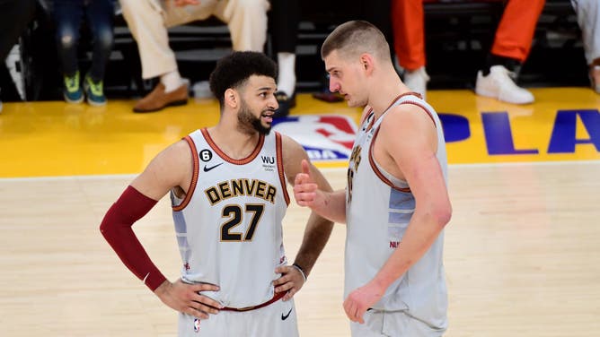 Denver Nuggets PG Jamal Murray talks with Nikola Jokic during the 2023 NBA Playoffs Western Conference Finals at Crypto.Com Arena in Los Angeles.