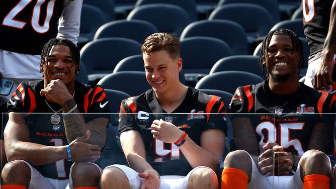 Ja'Marr Chase, Joe Burrow and Tee Higgins of the Cincinnati Bengals sit in the front for the Cincinnati Bengals team photo.