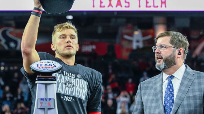 Shough sports a new hat and trophy after winning the MVP award for the TaxAct Texas Bowl vs. Ole Miss Rebels at NRG Stadium in Houston, Texas.