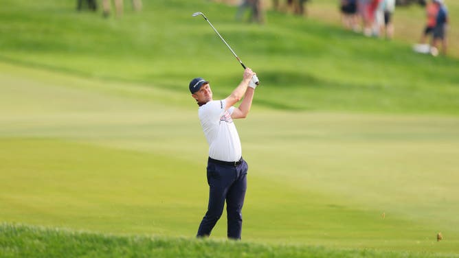 Justin Rose plays an approach shot on the 17th hole during the final round of the 2023 PGA Championship at Oak Hill Country Club in Rochester, New York.