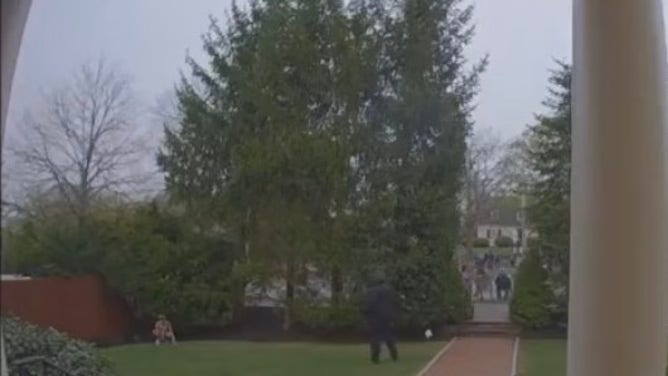 Boston Marathon takes poop on someone's lawn.
