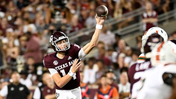 Max Johnson (14) of the Texas A&M Aggies