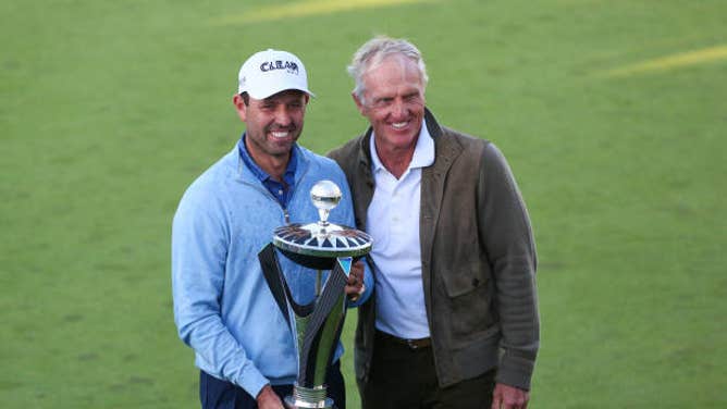 Charl Schwartzel and Greg Norman hold LIV trophy