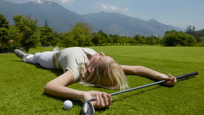 Grace Charis Takes A Break From Chasing Paige Spiranac In Some Cut-Off Shorts While Trying Her Hand At Archery