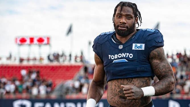 Toronto Argonauts defensive end Shawn Oakman runs onto the field.