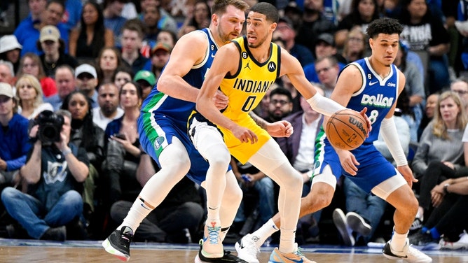 Indiana Pacers PG Tyrese Haliburton posts up Dallas Mavericks All-Star Luka Doncic at American Airlines Center in Texas.