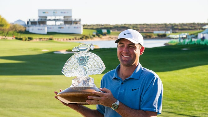 Scottie Scheffler celebrates with the trophy after winning the 2023 WM Phoenix Open at TPC Scottsdale. (Allan Henry-USA TODAY Sports)