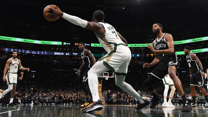 Boston Celtics wing Jaylen Brown catches the ball on the baseline vs. the Brooklyn Nets SF Mikal Bridges at TD Garden. (Bob DeChiara-USA TODAY Sports)