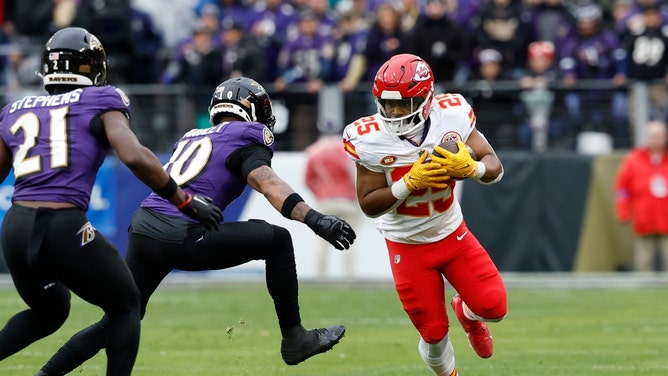 Kansas City Chiefs RB Clyde Edwards-Helaire runs the ball against the Baltimore Ravens during the 2024 AFC championship at M&T Bank Stadium in Maryland.