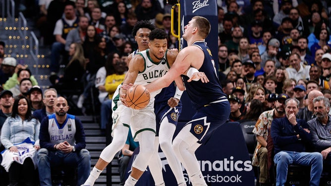 Milwaukee Bucks PF Giannis Antetokounmpo gets into the paint on Denver Nuggets All-Star Nikola Jokic at Ball Arena in Colorado.