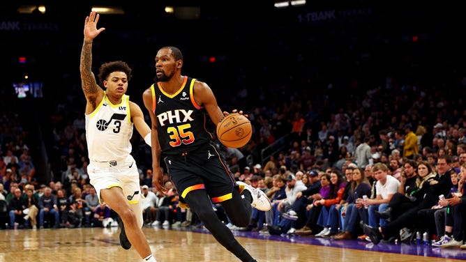 Phoenix Suns All-Star Kevin Durant drives to the basket on Utah Jazz SG Keyonte George at Footprint Center in Arizona. (Mark J. Rebilas-USA TODAY Sports)