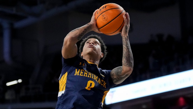 Merrimack Warriors guard Adam Clark (0) drives to the basket against the Cincinnati Bearcats in the second half at Fifth Third Arena.