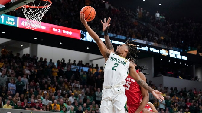 Baylor Bears SG Jayden Nunn drives to the basket on the Houston Cougars at Paul and Alejandra Foster Pavilion. (Raymond Carlin III-USA TODAY Sports)