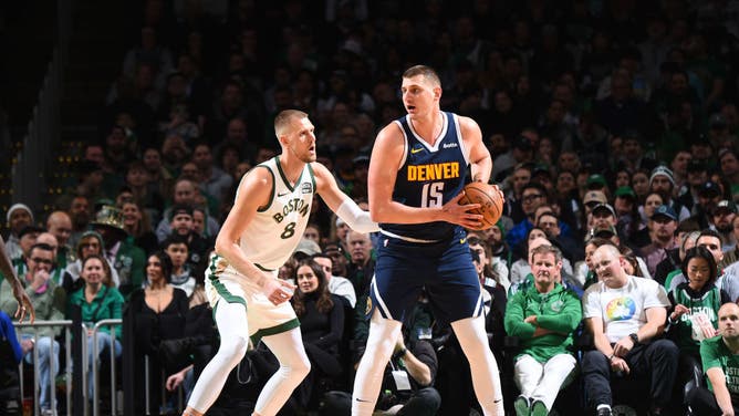 Nikola Jokic operates out of the post vs. Boston Celtics C Kristaps Porzingis at the TD Garden. (Photo by Brian Babineau/NBAE via Getty Images)