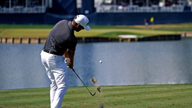 Corey Conners plays his shot from the 17th tee during the final round of The Players Championship 2022 at TPC Sawgrass - Stadium Course in Ponte Vedra Beach, Florida. (Jasen Vinlove-USA TODAY Sports)
