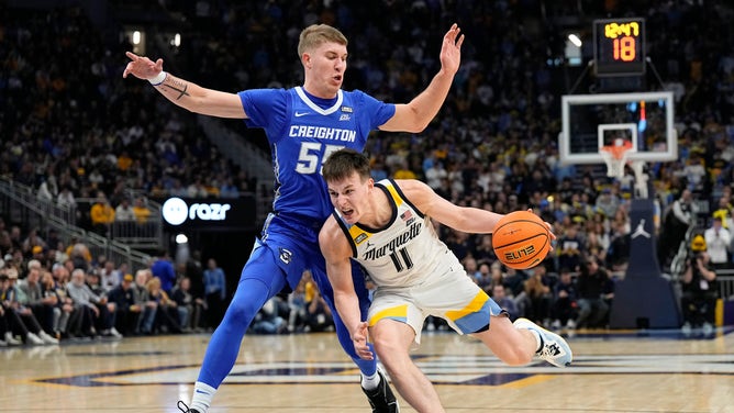 Marquette Golden Eagles PG Tyler Kolek drives to the basket on Creighton Bluejays SG Baylor Scheierman at Fiserv Forum in Wisconsin. (Jeff Hanisch-USA TODAY Sports)