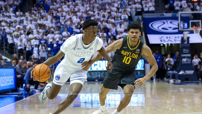 BYU Cougars guard Jaxson Robinson drives the ball on Baylor Bears PG RayJ Dennis at Marriott Center. (Rob Gray-USA TODAY Sports)