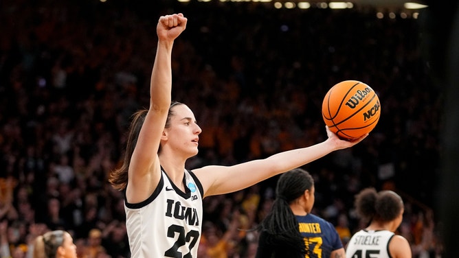 Iowa Hawkeyes guard Caitlin Clark (22) celebrates in the final seconds of a second-round NCAA Tournament game between Iowa and West Virginia, Monday, March 25, 2024 at Carver Hawkeye Arena in Iowa City.