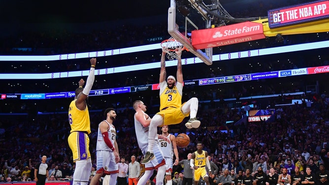 Los Angeles Lakers PF Anthony Davis jams it on Denver Nuggets C Nikola Jokic during Game 4 of the 2024 NBA Western Conference Finals at Crypto.com Arena. (Gary A. Vasquez-USA TODAY Sports)