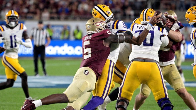 LSU Tigers QB Jayden Daniels is sacked by Florida State Seminoles DE Jared Verse at Camping World Stadium in Florida. (Melina Myers-USA TODAY Sports)