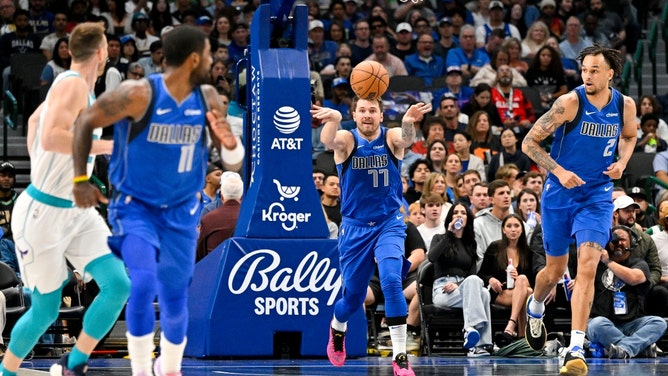 Dallas Mavericks' Luka Doncic throws an outlet pass to Kyrie Irving vs. the Charlotte Hornets at the American Airlines Center in Texas. (Jerome Miron-USA TODAY Sports)