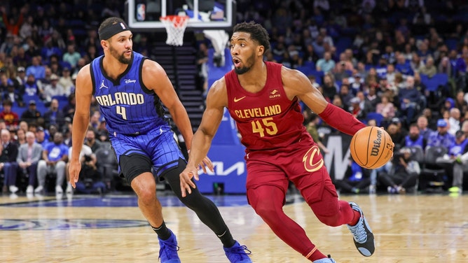 Cleveland Cavaliers SG Donovan Mitchell drives past Orlando Magic combo guard Jalen Suggs at Amway Center in Florida. (Mike Watters-USA TODAY Sports)