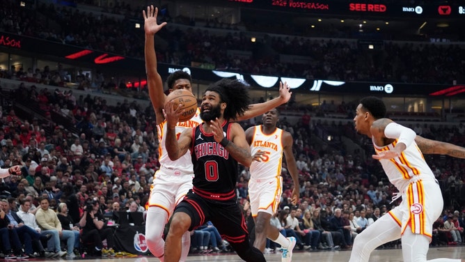 Chicago Bulls SG Coby White blows past Atlanta Hawks SF De'Andre Hunter a play-in game for the 2024 NBA playoffs at United Center in Illinois. (David Banks-USA TODAY Sports)
