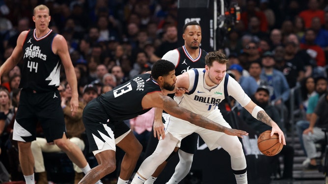 Los Angeles Clippers wing Paul George tries to steal the ball from Dallas Mavericks All-Star Luka Doncic during Game 2 of the 1st round for the 2024 NBA playoffs at Crypto.com Arena. (Kiyoshi Mio-USA TODAY Sports)