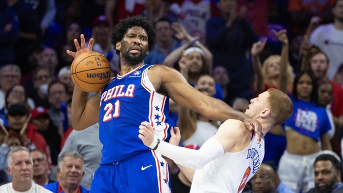 Sixers C Joel Embiid is "fouled" by New York Knicks SG Donte DiVincenzo in Game 3 of the ist round for the 2024 NBA playoffs at Wells Fargo Center in Phildelphia. (Bill Streicher-USA TODAY Sports)