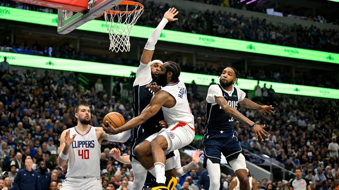 LA Clippers' James Harden passes the ball around Dallas Mavericks forward P.J. Washington during Game 3 in the 1st round of the 2024 NBA playoffs at the American Airlines Center in Dallas. ( erome Miron-USA TODAY Sports)