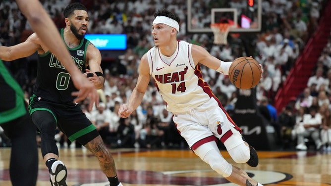 Miami Heat SG Tyler Herro drives to the basket on Boston Celtics SF Jayson Tatum during Game 3 of the 1st round for the 2024 NBA playoffs at Kaseya Center in Florida. (Jim Rassol-USA TODAY Sports)