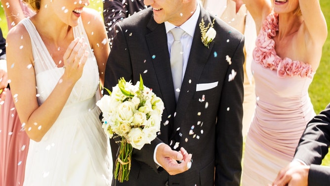 married couple in a relationship with their bridesmaid