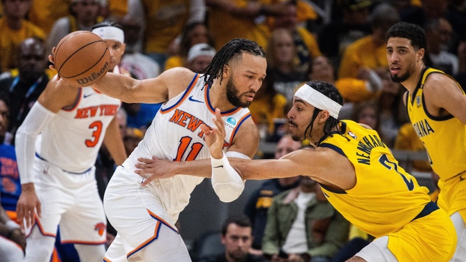 New York Knicks PG Jalen Brunson protects the ball from Indiana Pacers SG Andrew Nembhard during Game 6 of the Eastern Conference Semifinals in the 2024 NBA Playoffs at Gainbridge Fieldhouse in Indiana. (Trevor Ruszkowski-USA TODAY Sports)