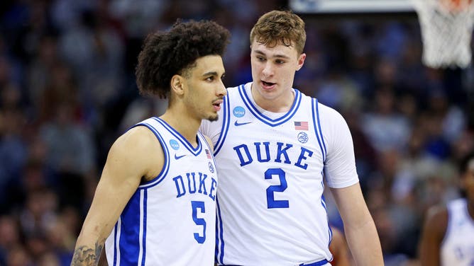 Duke Blue Devils guard Tyrese Proctor talks with forward Cooper Flagg during the 2025 NCAA Tournament Elite Eight.