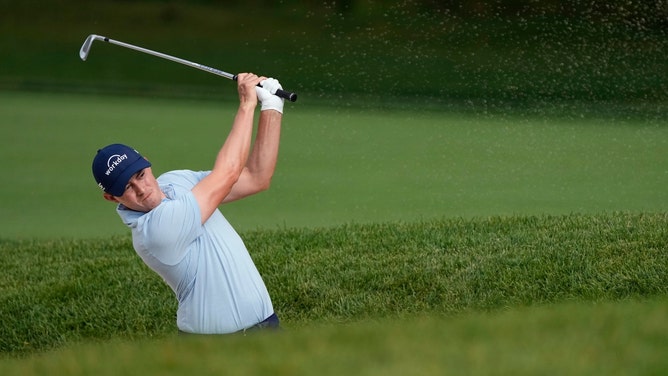 Matthew Fitzpatrick hitting out of a bunker in the 2024 Memorial at Muirfield. (Photo credit: Adam Cairns-Imagn Images)