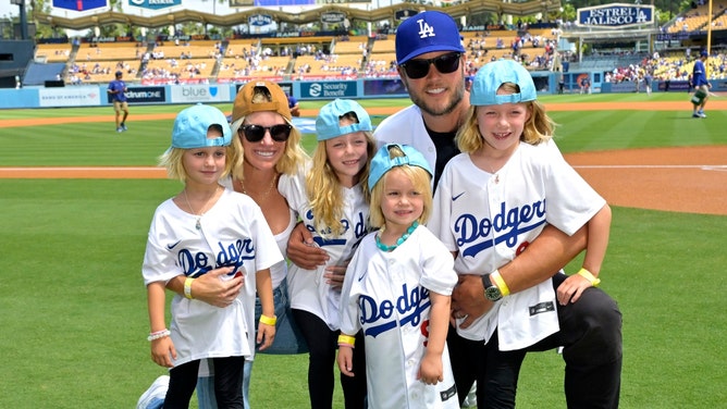 Los Angeles Rams QB Matthew Stafford and his wife, Kelly, posing with their four daughters before a Dodgers game. (Photo credit: Jayne Kamin-Oncea-Imagn Images)