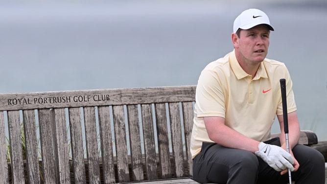 Robert MacIntyre is sitting on a bench during a practice round for The 153rd Open Championship at Royal Portrush. (Photo credit: Stuart Franklin/Getty Images)